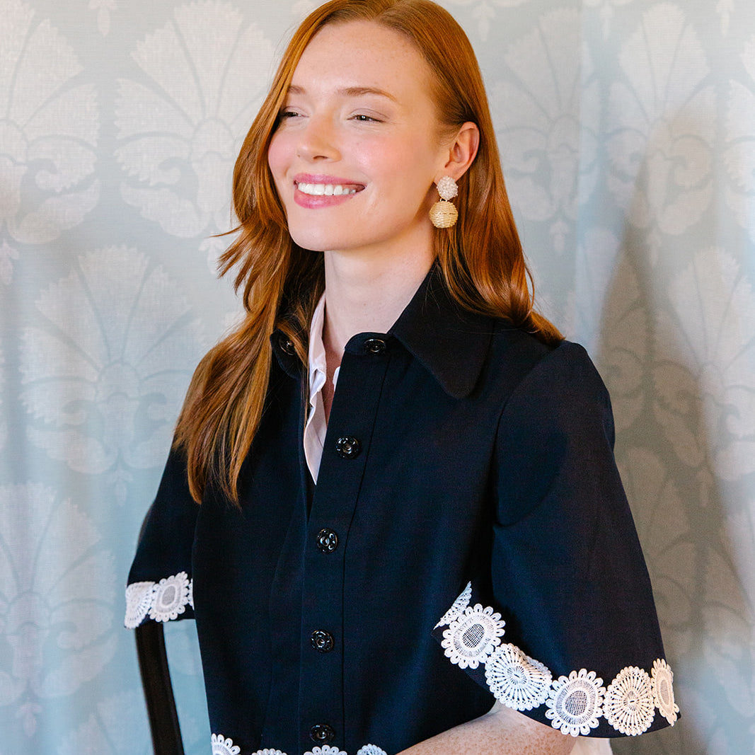 Model is wearing Liz White Rattan Ball Earrings_m donohue collection