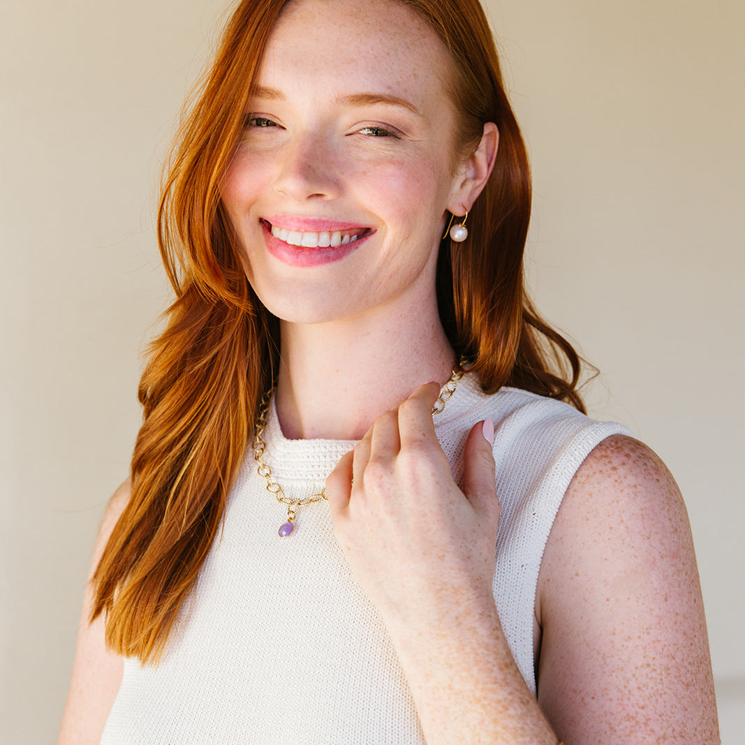 Model wears the Bloom Pearl Hook earring_m donohue collection