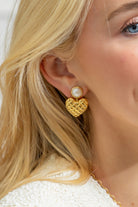 Model wearing Elizabeth Pearl Heart Drop Earrings_M Donohue Collection