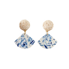 Pair of earrings with marbled blue and white design on a white background Rattan post with blue and white acrylic shell_m donohue collection