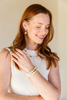 Model is wearing the Remy Wicker Necklace with Remy White Pearl Drop Earrings_m donohue collection