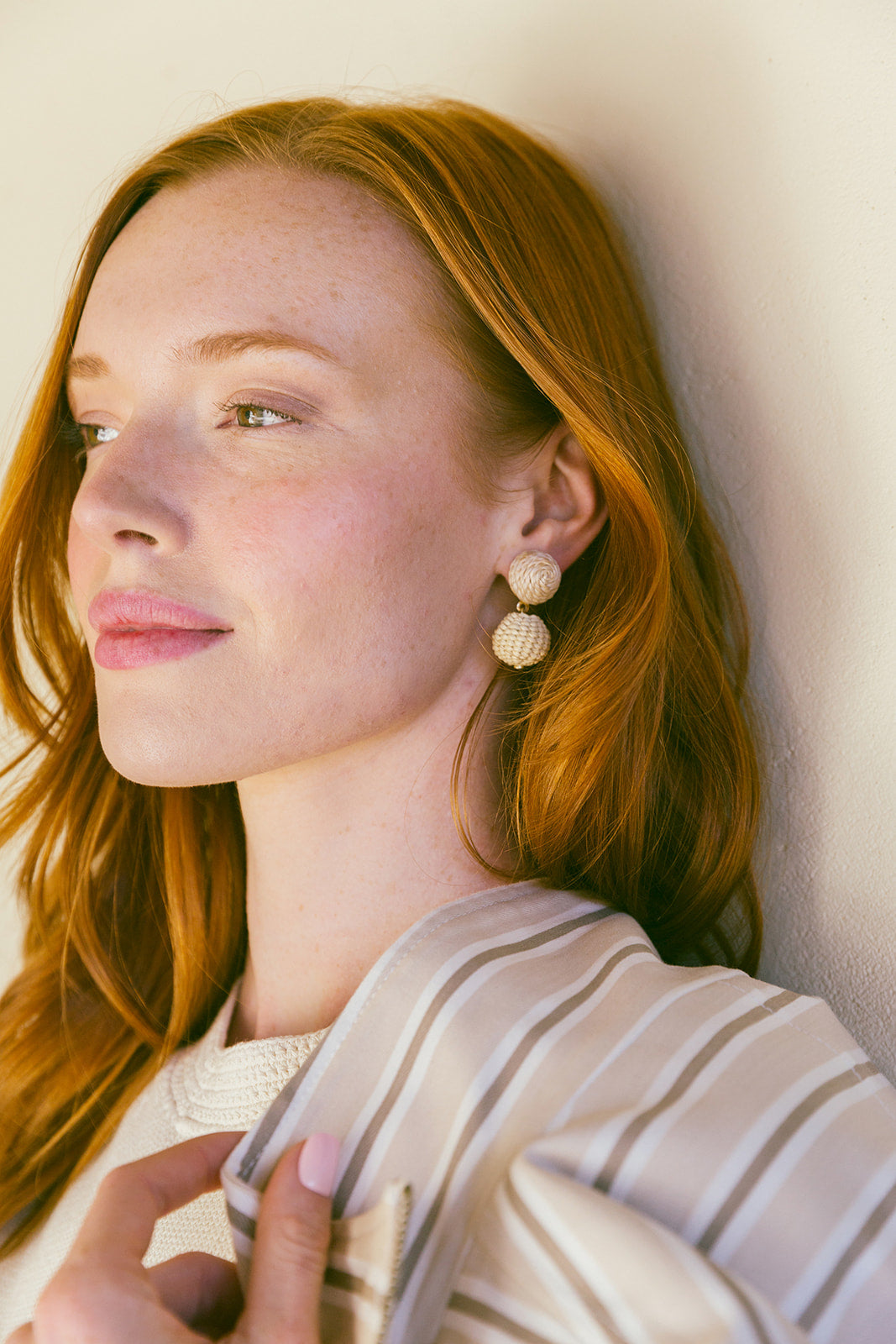 Model wears Grace Mini Rattan Ball earring_m donohue collection