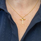 model wearing gold palm cross necklace_m donohue collection