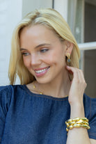 model wearing gold and blue quartz earrings_m dohohue collection