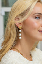 Model wearing Gold Lattice Cotton Pearl Triple Drop Earrings_M Donohue Collection