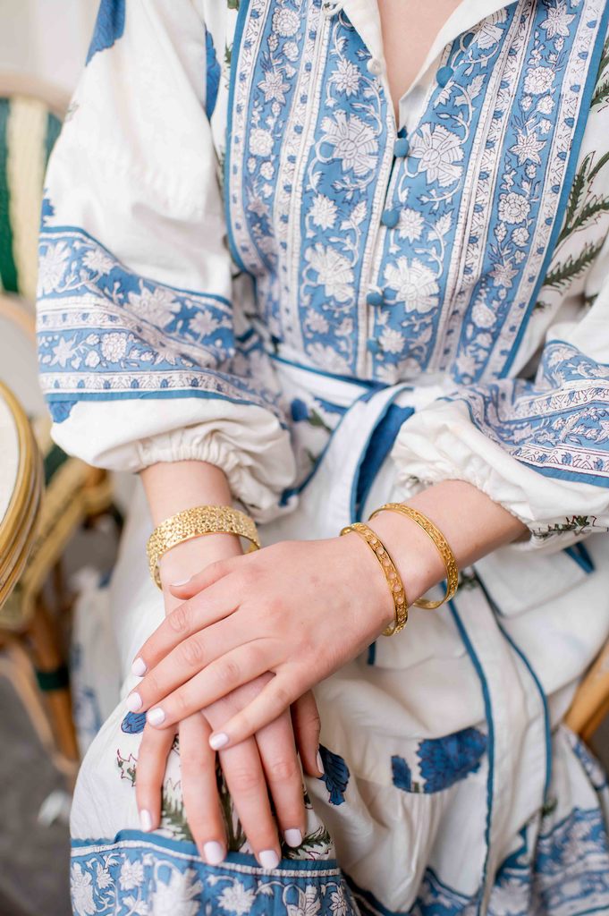 Model is wearing Jardin Hydrangea Gold Bangle with Maison & Versailles Treillage Gold Bangles_m donohue collection