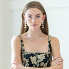 Model is wearing Liz Cotton Pearl Triple White Earrings_m donohue collection