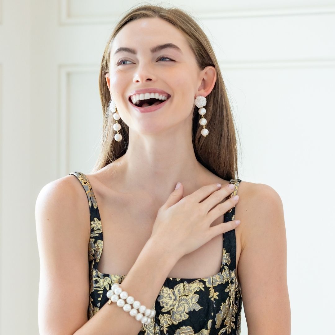 Model is wearing Liz Cotton Pearl Triple White Earrings_m donohue collection