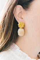 Model is wearing Liz Yellow Rattan Ball Earrings_m donohue collection