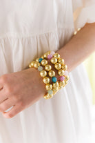 Model is wearing Pamela Gold & Rose Bracelet with Pamela Sage, Aqua, and Lilac Bracelets_m donohue collection